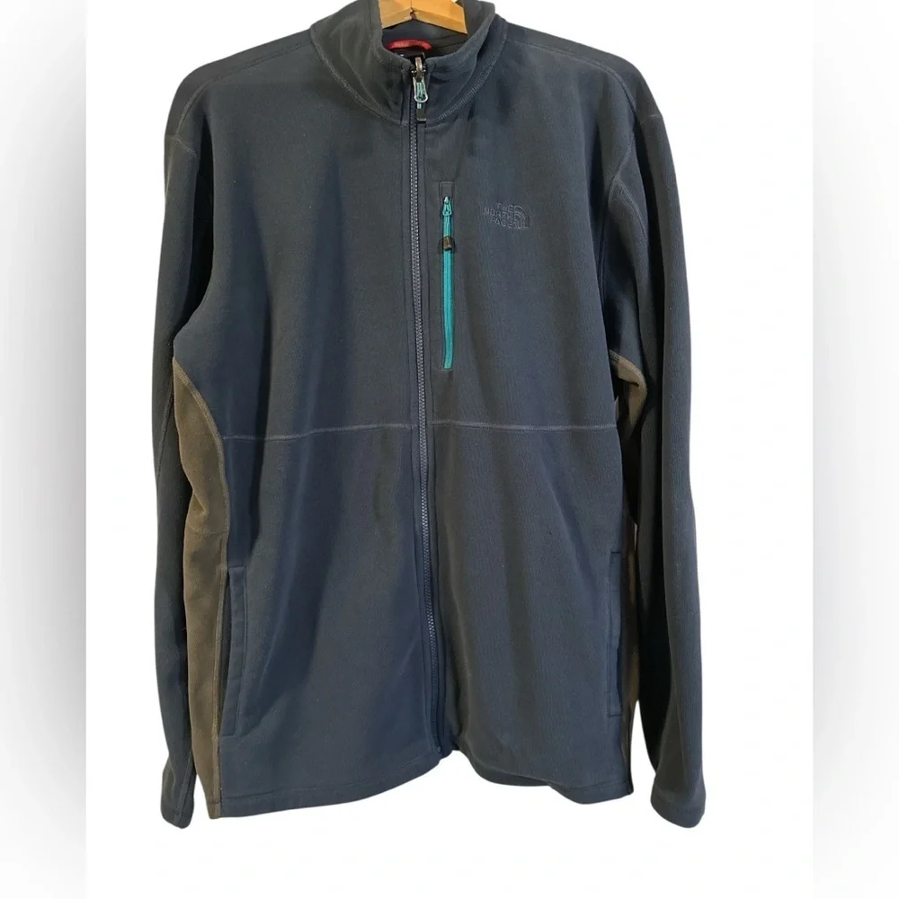 The North Face Navy Blue Fleece with Teal Accent Pocket and Dark Gray Side Panel